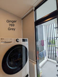 Ginger Series dark grey room darkening roller blind installed on a  window